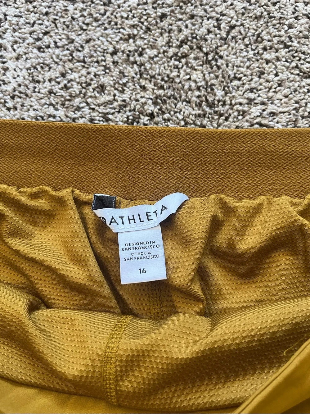 Athleta Mustard Mini Skirt with Snap Flap Pockets